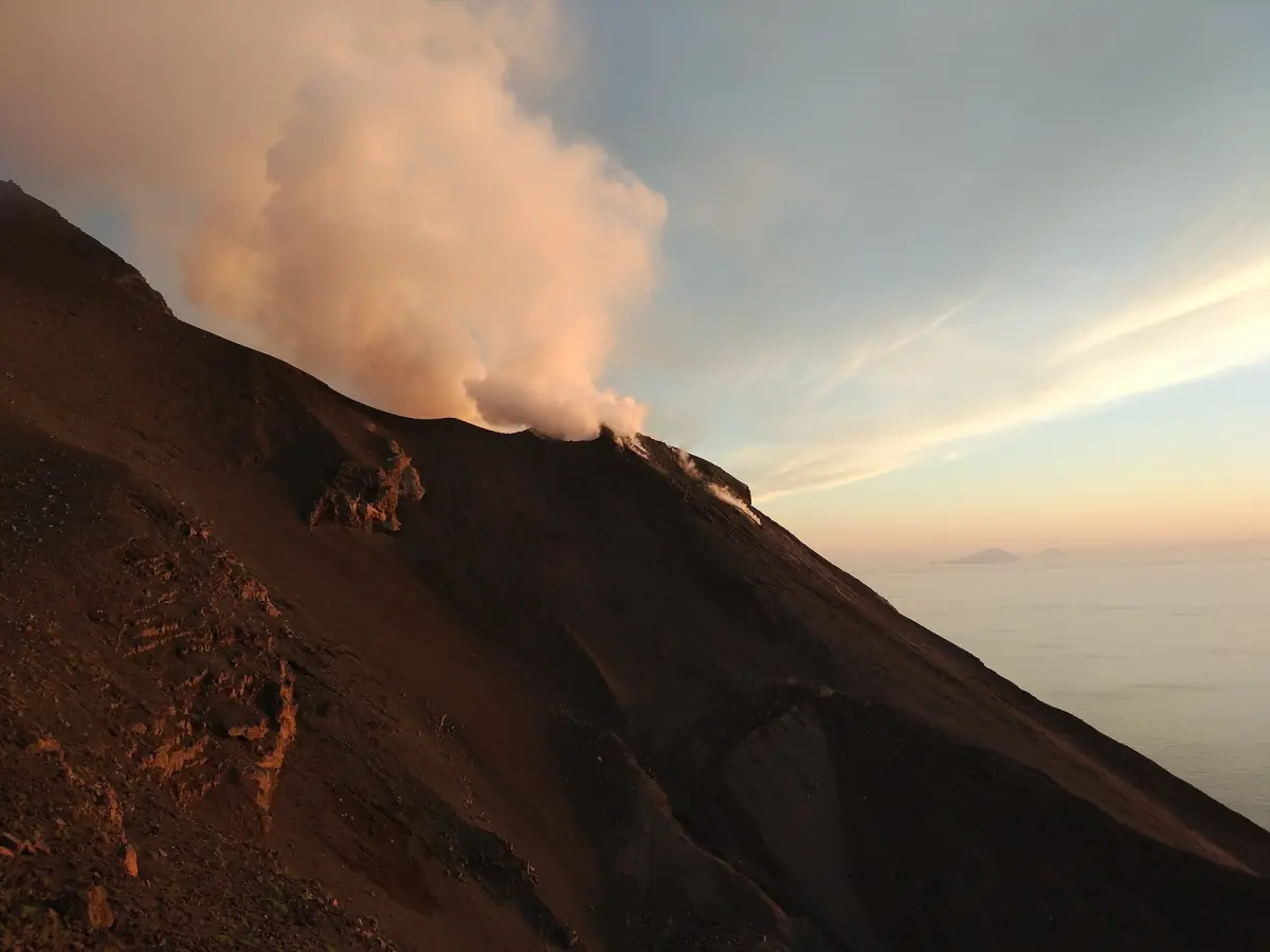 Steam above the summit craters at sunset